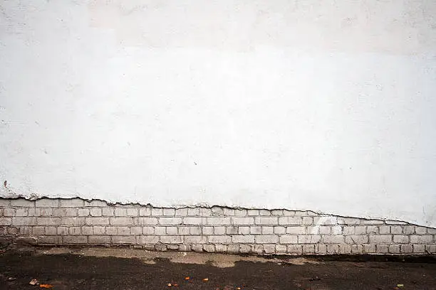 White brick and plastered wall background