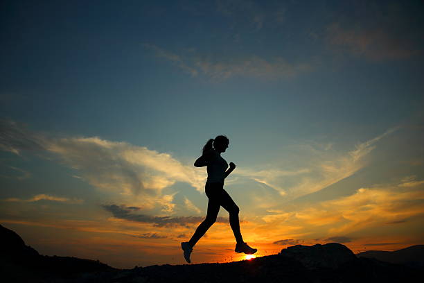 istock Silhouette of running woman 509617356