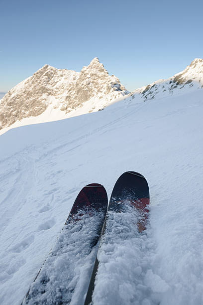 istock Pair of skis on the snow slope 509617622