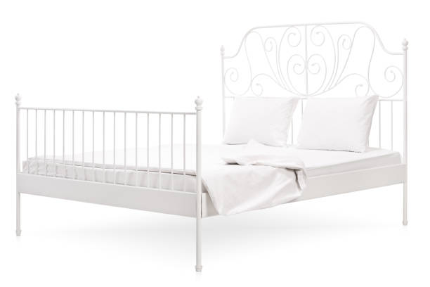 istock White bed with a vintage decoration 509617804