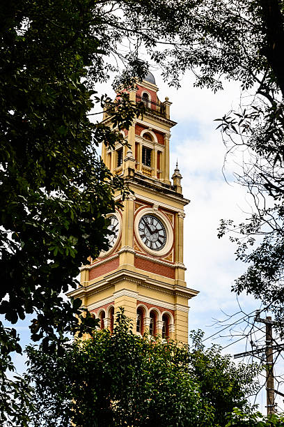 Clock Tower of Luz Train Station, Sao Paulo, Brazil Across the street from the Parque da Luz and the Pinacoteca museum in Sao Paulo's historic central district sits Estação da Luz , a classic late-Victorian train station built in Britain and assembled Sao Paulo in 1901. It services São Paulo’s extensive suburban lines, with a long tunnel linking it to the Luz metro station. pinacoteca sao paulo stock pictures, royalty-free photos & images