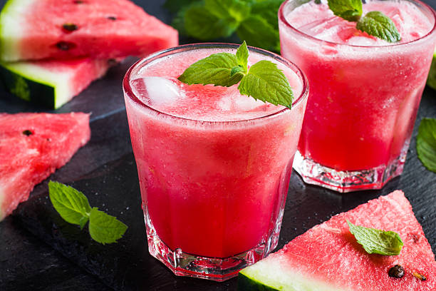 refreshing watermelon cocktail with ice and mint stock photo