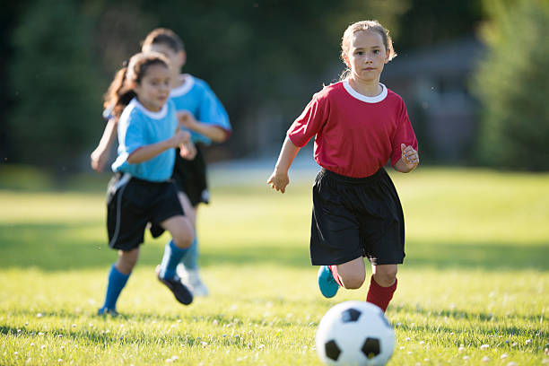 istock Girl Kicking a Soccer Ball 509620170