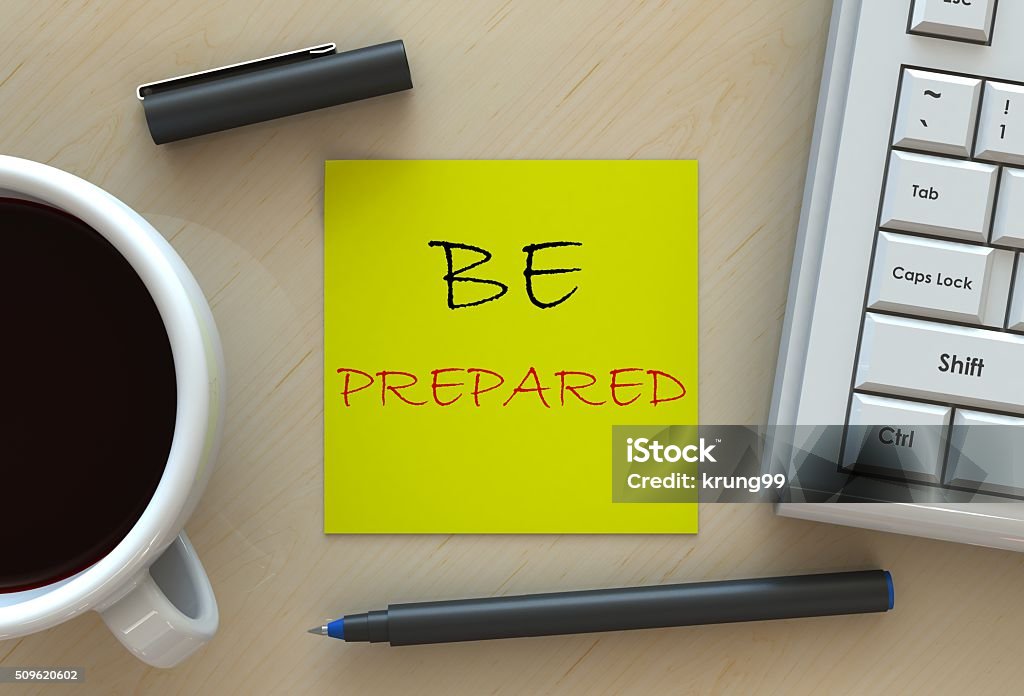 BE PREPARED, message on business note paper BE PREPARED, message on business note paper, computer and coffee on table Preparation Stock Photo