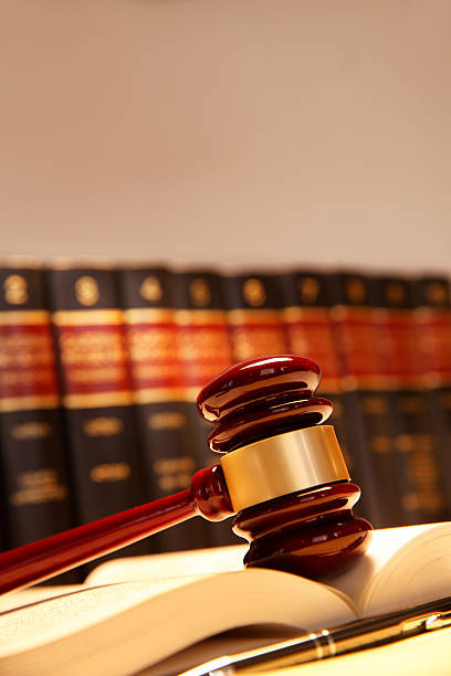 istock Gavel Resting On Top Of Open Law Book 509620752