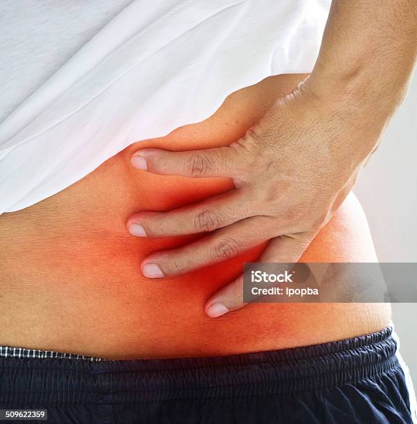 Backache Pain In The Lower Back Stock Photo - Download Image Now - Adult, Alternative Therapy, Anatomy