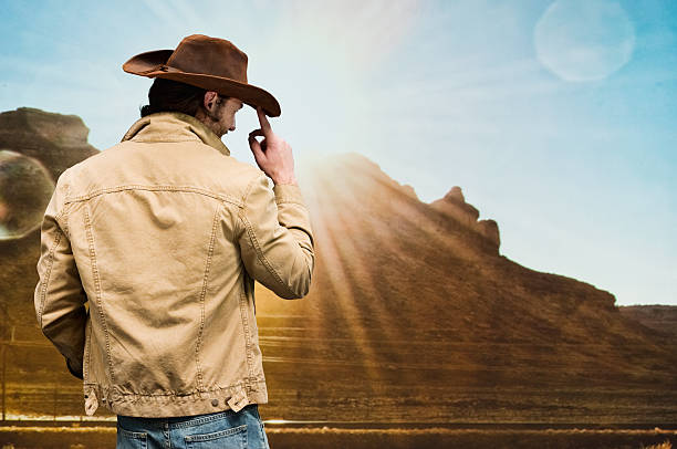 istock Cowboy standing in front of hill 509623348