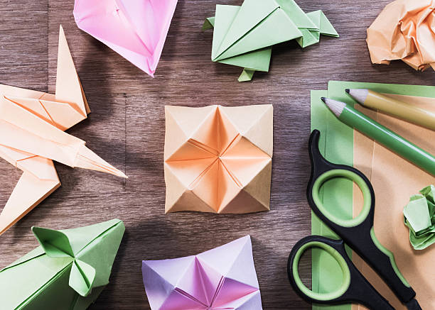 istock Origami figures on wooden table - close up. 509623504