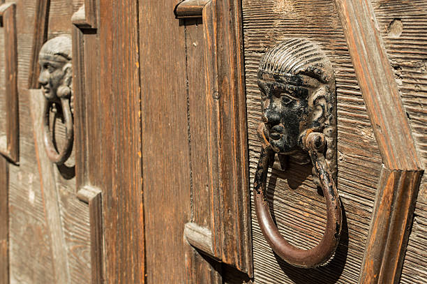 istock old wooden door with knocker in bronze 509623779