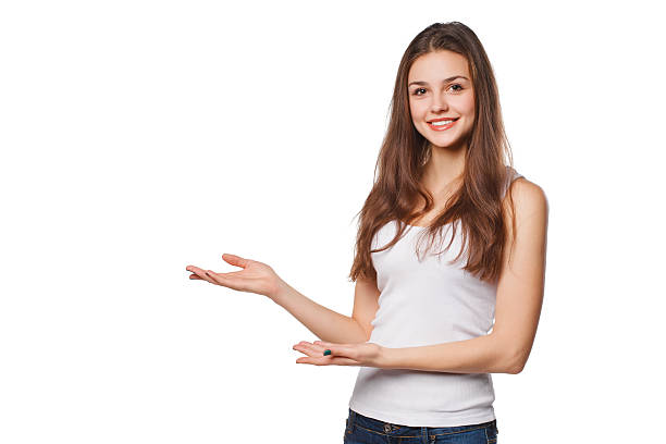 Smiling woman showing open hand palm with copy space