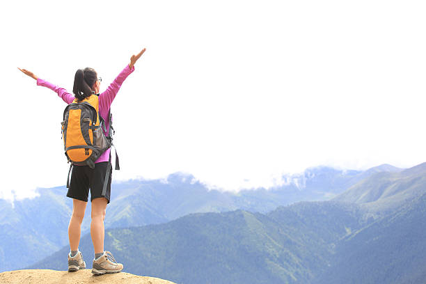 istock cheering hiking woman  mountain peak 509624757