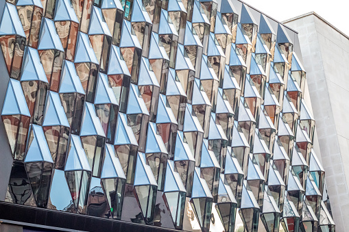 Building with triangular windows in London