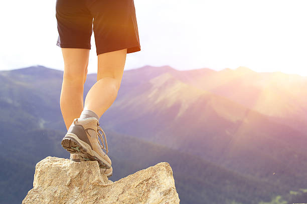 istock hiking feet  mountain peak 509626955
