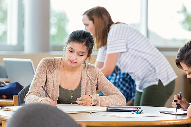 istock Hispanic young woman works on project in design firm 509627762
