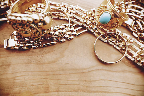istock Gold jewelry with wood background 509627831