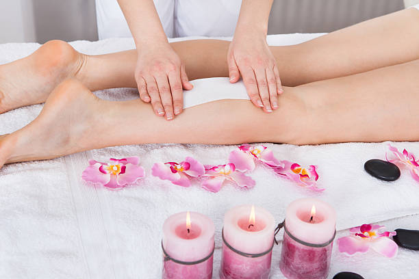 istock Beautician Waxing Woman's Leg 509628275