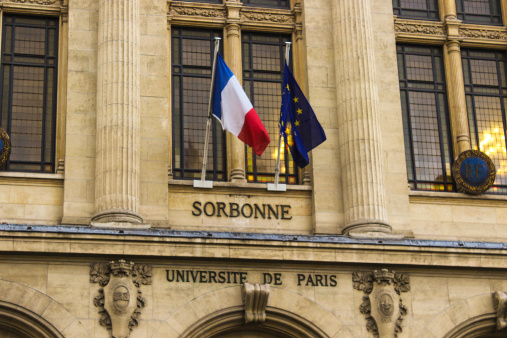Picture was taken in January 2014. It presents the facade os the University of Paris Sorbonne with and French and European flag.