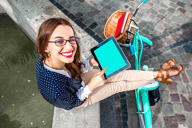 istock Business woman on bicycle using tablet 509629999