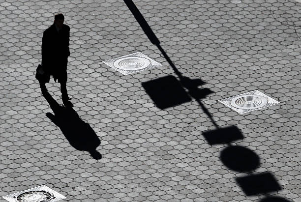 istock Shadow of the man on pavement 509630191