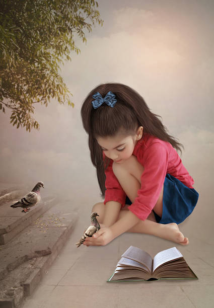 istock Little girl with pigeons 509630756