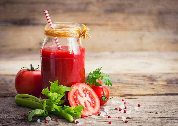 Tomato juice in the jar stock photo
