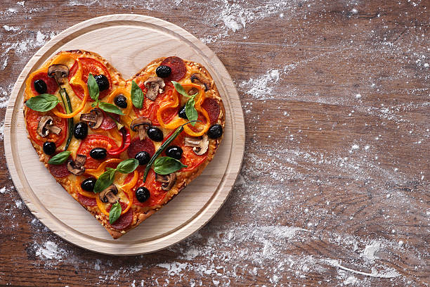 istock Baked heart-shaped homemade pizza 509632446