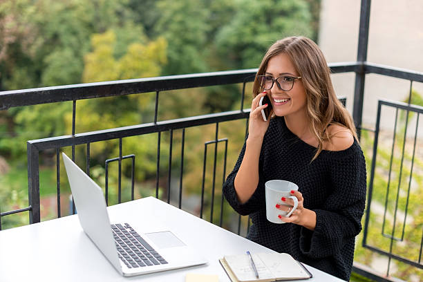 istock Smiling Young woman talking on mobile phone 509633168