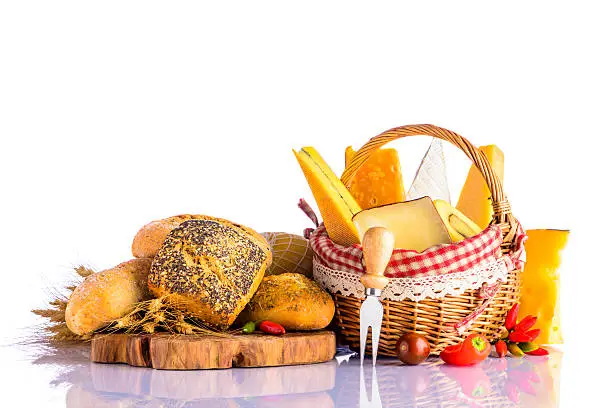 Bread, bun and emmental, swiss-cheese, morbier, brie cheese with food on white background