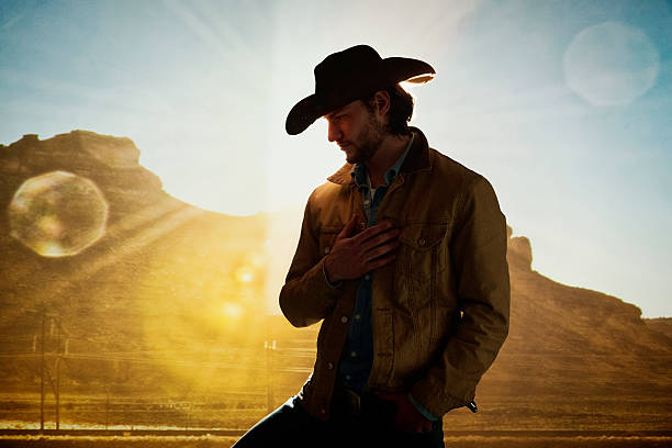 istock Cowboy standing in front of hill 509635320