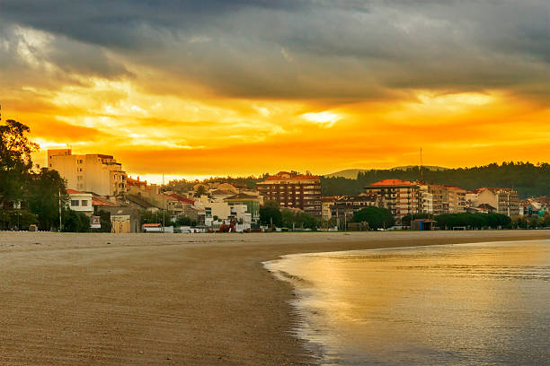 Red sunrise on the beach of Compostela