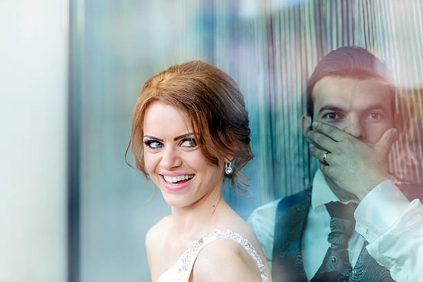 proud bride near depressed groom.