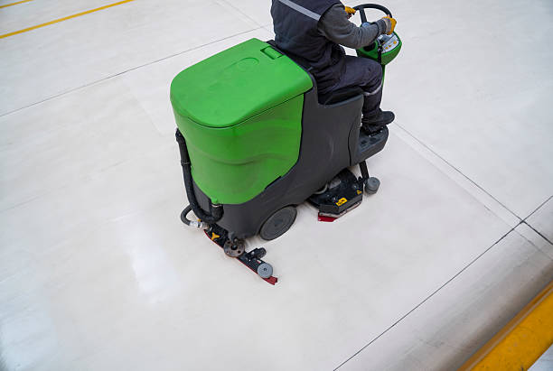 istock Worker is cleaning the floor with machine 509640738