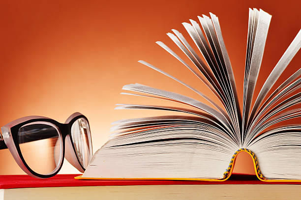 istock Composition with glasses and books on the table 509643329