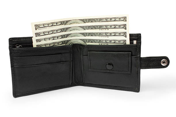 istock money in an open black leather purse 509643491