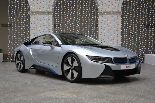 Ujazdowski Castle, Warsaw, Poland – May 12th, 2014: Presentation of a plug-in hybrid supercar BMW i8. This car have maximum output of 362 HP and peak torque of 320 Newton metres at the rear wheels and 250 Newton metres at the front, provides all-wheel-drive. The BMW i8 accelerates from 0 to 60 mph in 4.4 seconds.