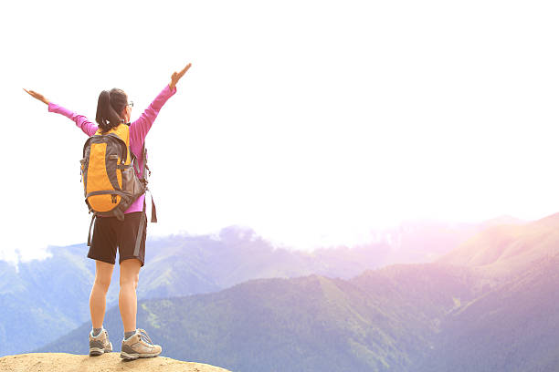 istock cheering hiking woman  mountain peak 509643659
