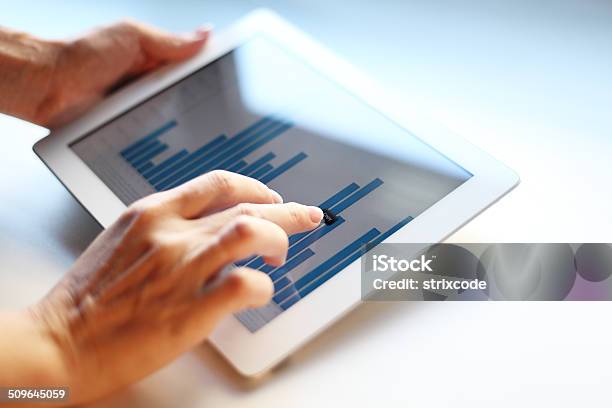 Businesswoman Holding Digital Tablet Stock Photo - Download Image Now - Adult, Adults Only, Analyzing