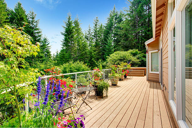 istock Wooden walkout deck with vibrant color flowers 509657075