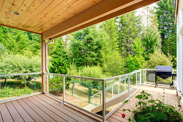 istock Wooden walkout deck with glass railing 509657081