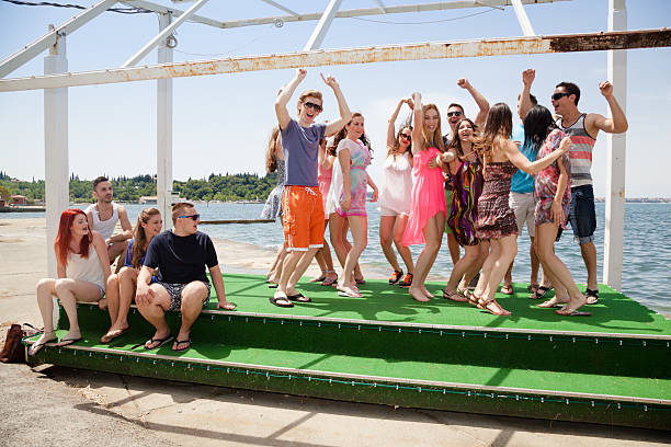 istock teenage youngsters have fun dancing at sunny seaside 509657161