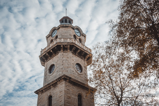 Old Clock Tower of Varna, Bulgaria with cloudy sky in the background.