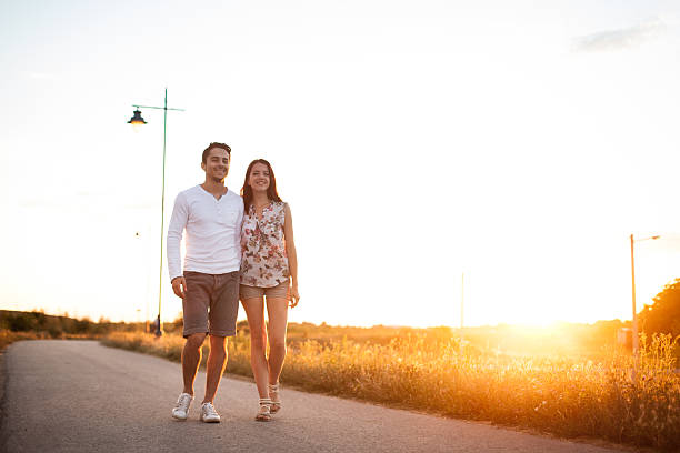 istock Love young couple holding hands and walking at park 509659450