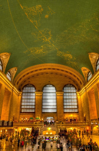 The beautiful terminal comes alive with passengers and tourists during a busy rush hour