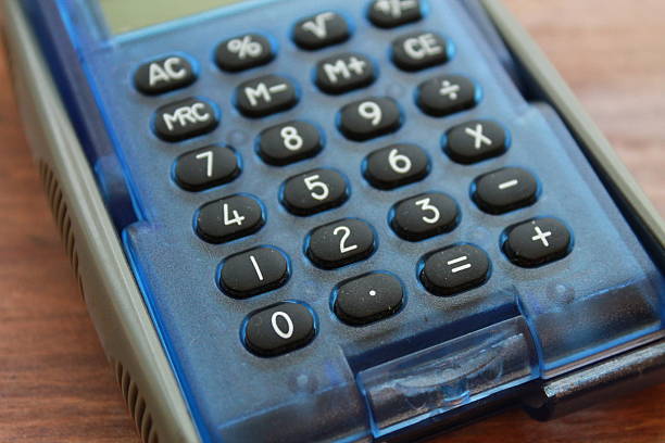 istock Partially out of focus blue calculator with black buttons 509660230