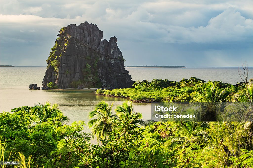 Landscape with Le Poulet Rock Formation Hienghene Bay New Caledonia Photo of a picturesque coastline and the Le Poulet (the hen) rock formation near Hienghene, New Caledonia, Grande Terre Island, New Caledonia. New Caledonia Stock Photo