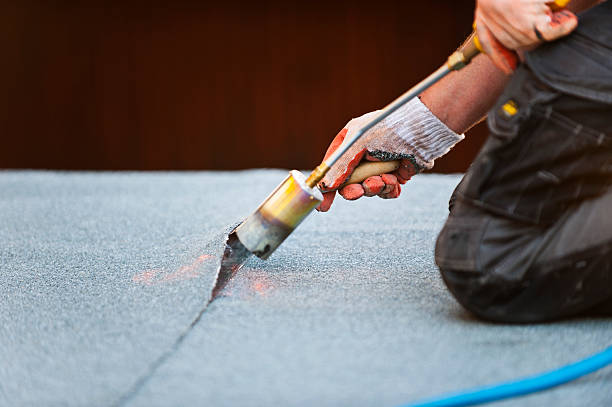 istock Flat roof covering works with roofing felt 509660777