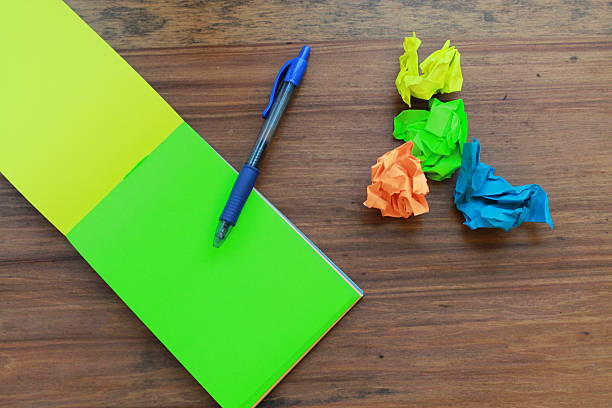istock Notepad and pen with colorful crumpled paper 509660954