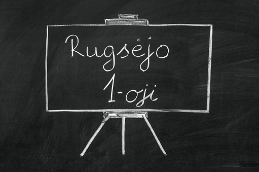 Rugsėjo pirmoji (September first) writed on blackboard with chalk