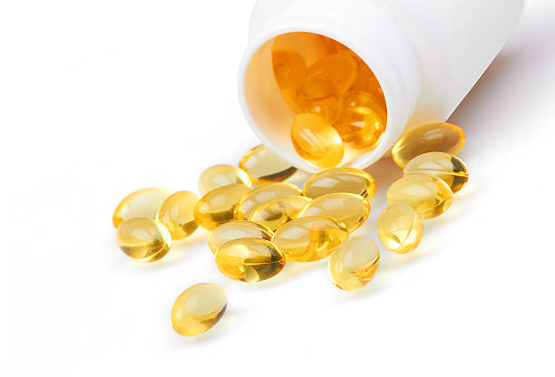 istock Yellow pills and pill bottle 509661093