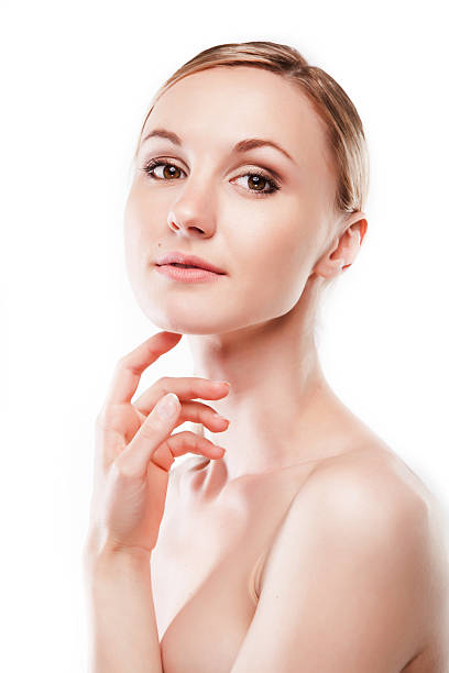 istock Young woman applying moisturizer cream 509661572